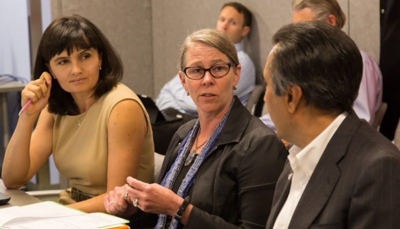 Older woman talking to a younger woman.